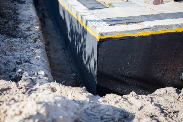 Professional Waterproofing technician working in Altamont, KS